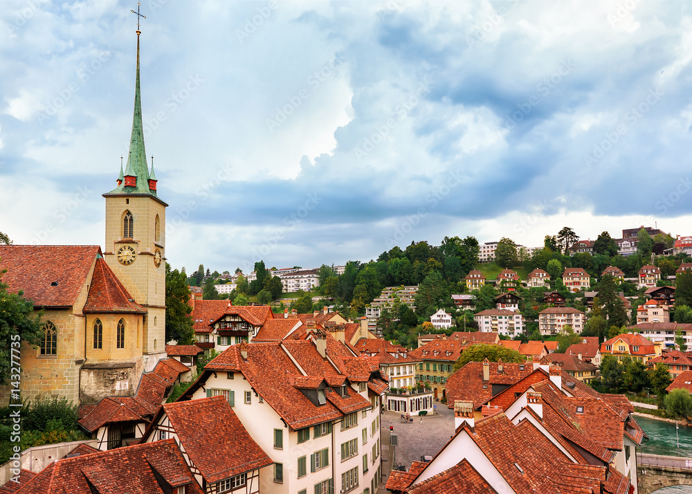 Nydegg Church and old houses rooftops in Bern