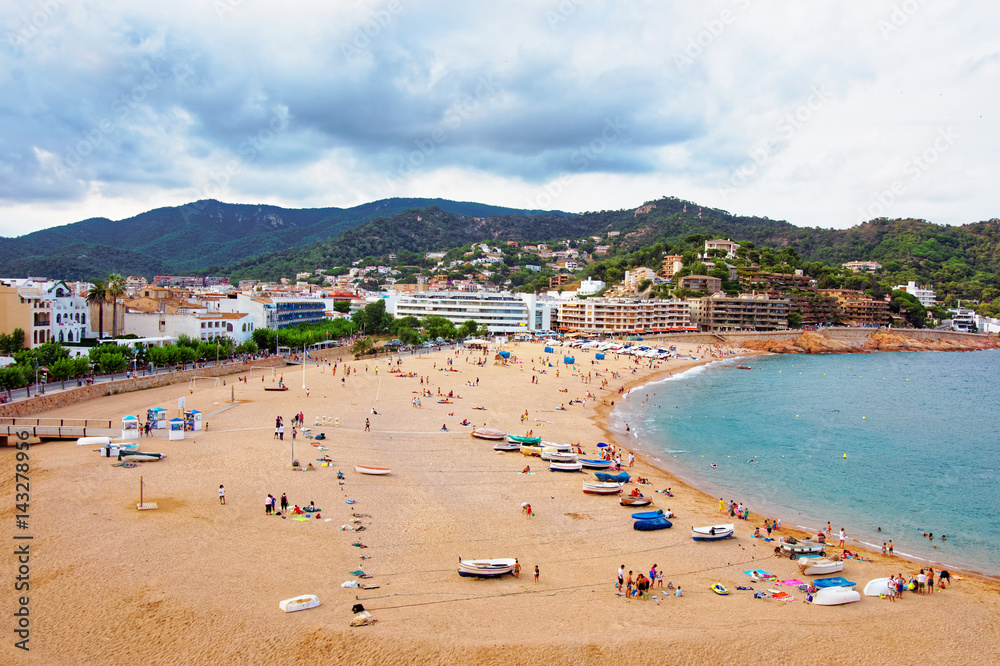 Beach with people at Tossa de Mar at Costa Brava