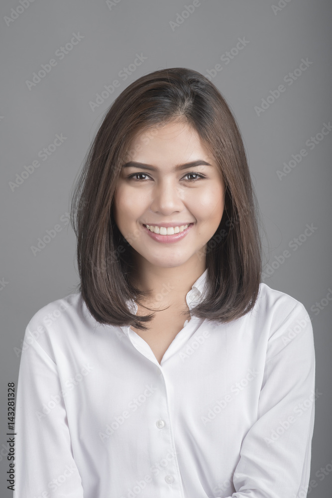 Beautiful Business Woman smiling on grey background Beautiful Business Woman smiling on grey background