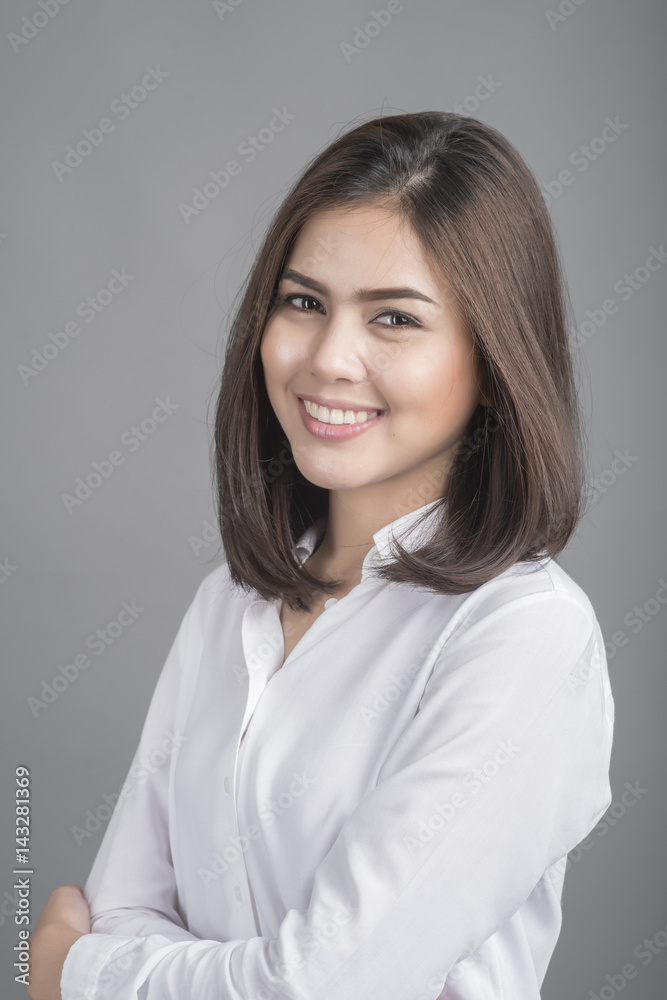 Beautiful Business Woman smiling on grey background Beautiful Business Woman smiling on grey background