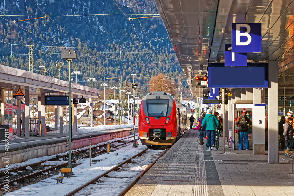 Passengers and high speed train in Garmisch Partenkirchen Germany