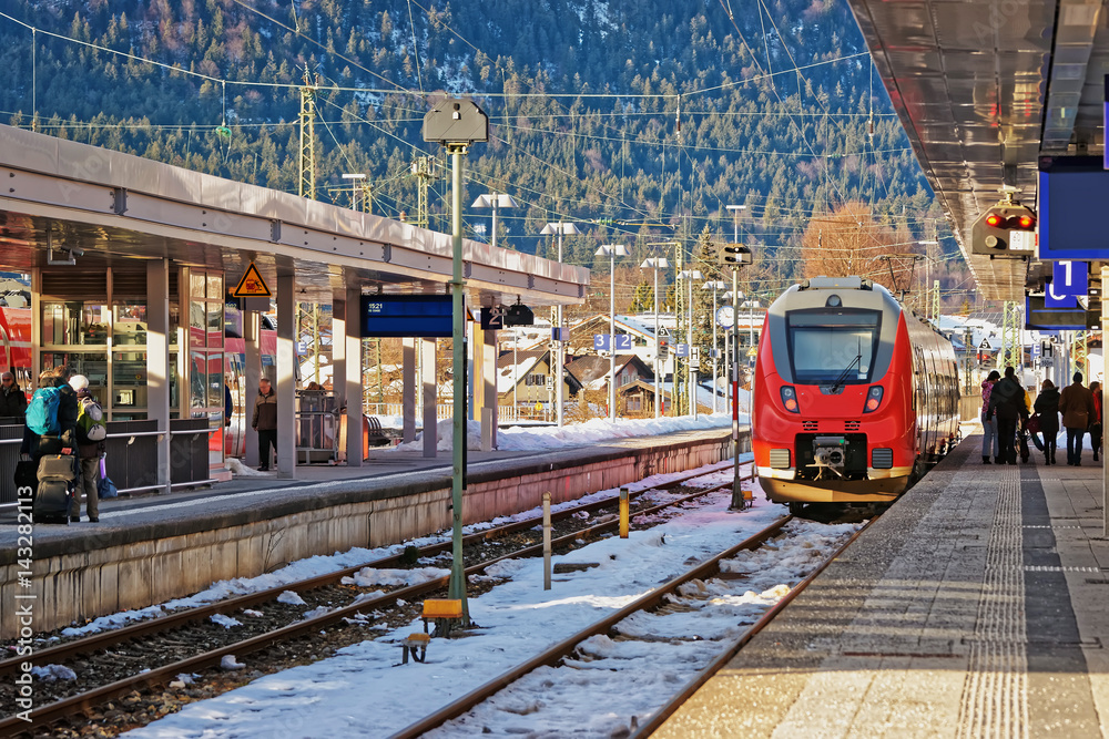 Naklejka premium Passengers and high speed train at Garmisch Partenkirchen in Germany