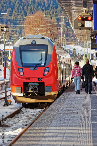 Passengers and high speed train at Garmisch Partenkirchen Germany