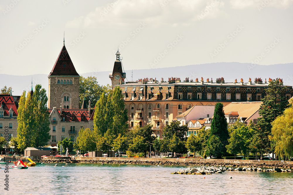 Fototapeta premium Chateau Ouchy at Geneva Lake promenade in Lausanne