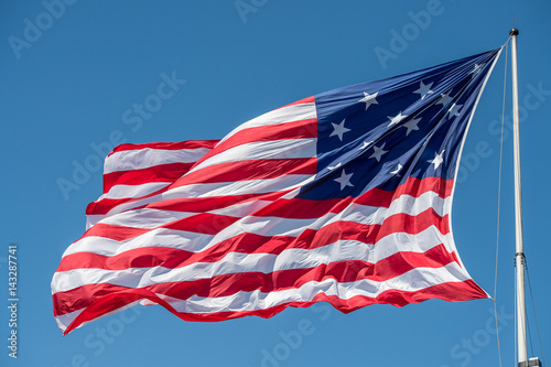 fort mchenry baltimore usa flag while waving photo