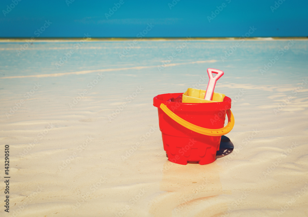 kid toys on tropical sand beach kid toys on tropical sand beach