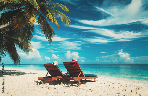 Two chairs on the tropical beach