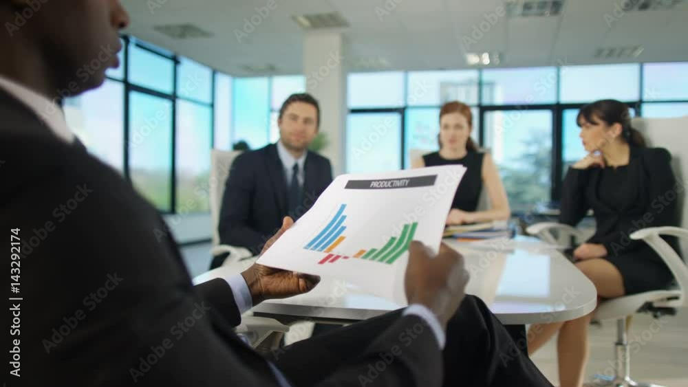 Attractive corporate business team in discussion in boardroom meeting Attractive corporate business team in discussion in boardroom meeting
