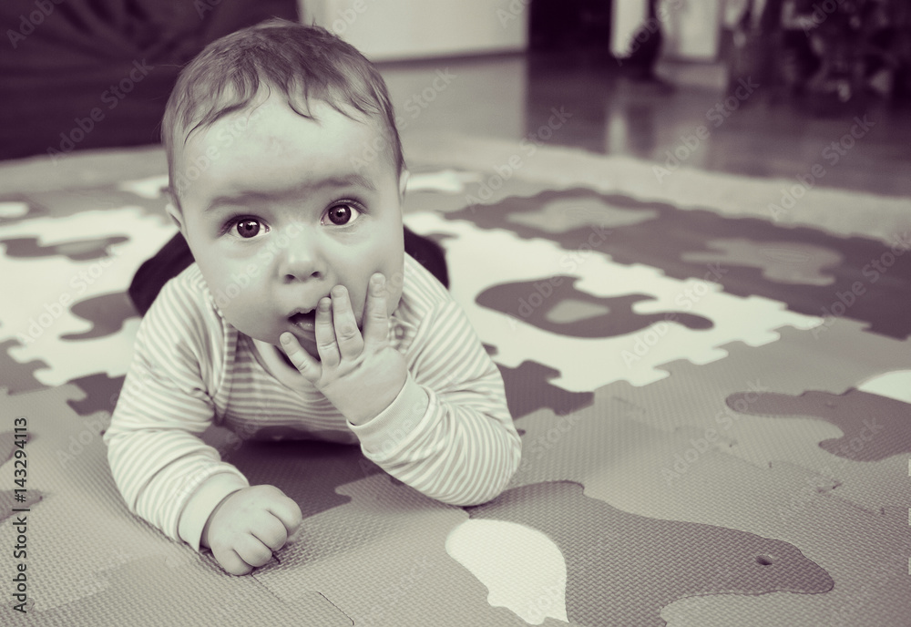 Naklejka premium Little baby is upset about something