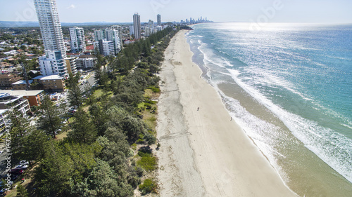Aerial view of Burleigh beach and surrounds at sunrise, with morning sun rise glistening off the ocean. Gold Coast, Australia © Bostock