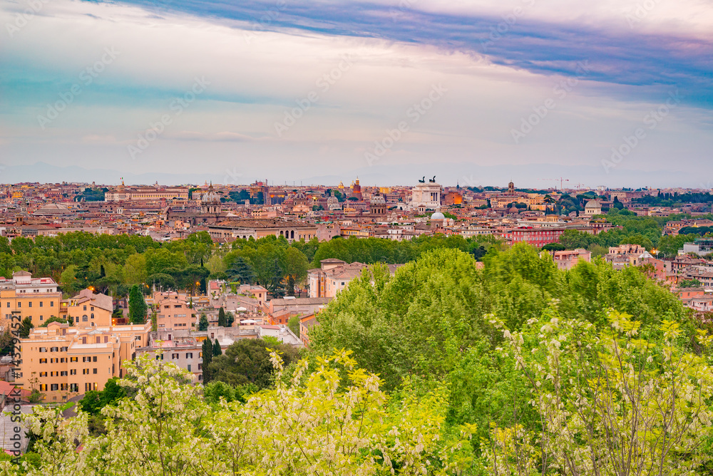 Rome, Italy, at dusk. Panoramic cityscape from above with cross processing filter applied.