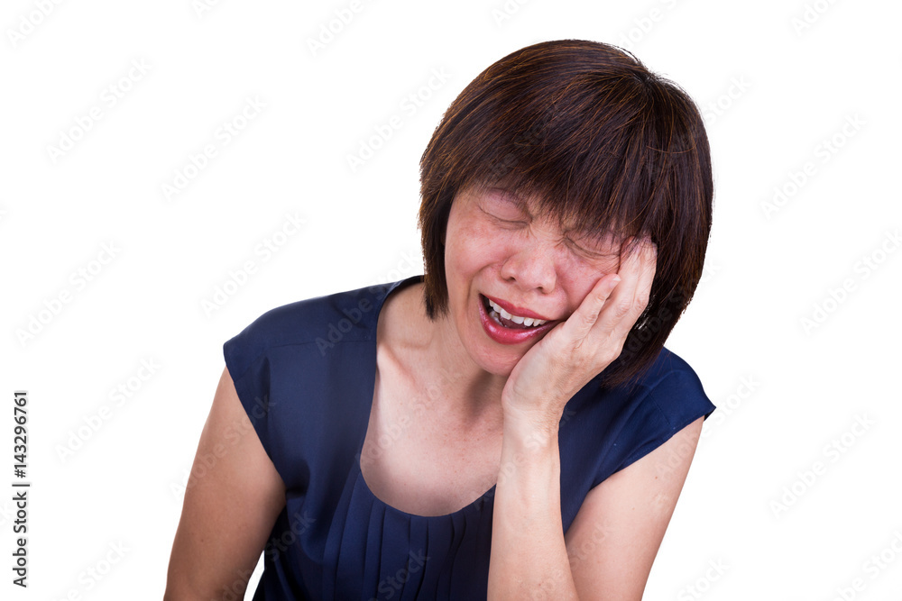 Asian woman in intense pain with hands over face Asian woman in intense pain with hands over face