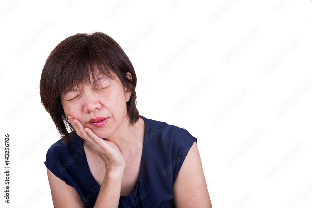 Asian woman suffering intense toothache pain with hands over face Asian woman suffering intense toothache pain with hands over face