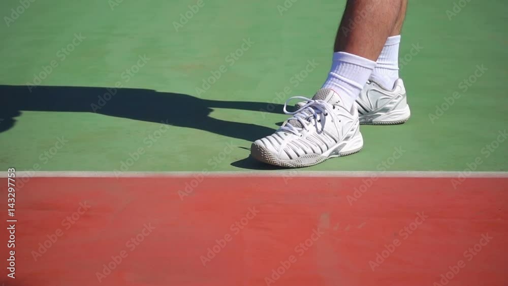 tennis player bouncing the ball slow motion close up on feet tennis player bouncing the ball slow motion close up on feet