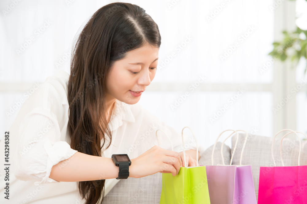 charming asian woman enjoy online shopping with smartwatch charming asian woman enjoy online shopping with smartwatch