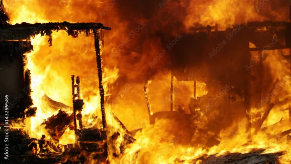 House on fire burning in slow motion