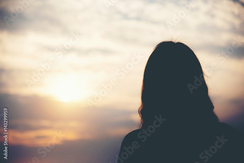 silhouette of woman in sunset , relax concept