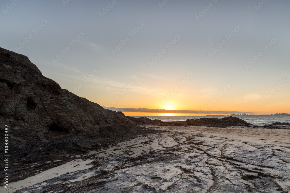 Sunrise eclipsed by the clouds at Currumbin Rock. Gold Coast Australia