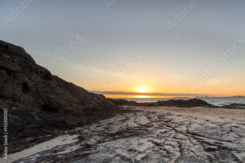 Sunrise eclipsed by the clouds at Currumbin Rock. Gold Coast Australia