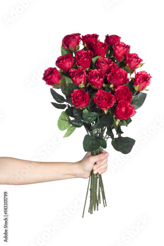 Fototapeta Naklejka Na Ścianę i Meble -  Hand holding bouquet of red roses