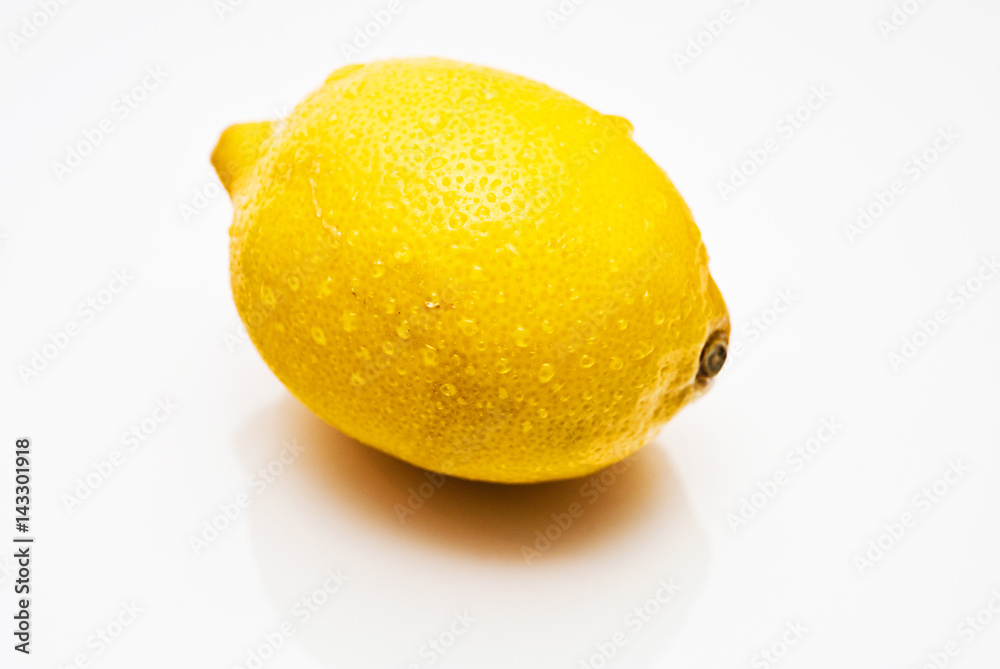 Yellow lemon on the white background