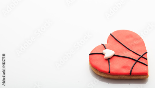 Heart shaped biscuit on white background