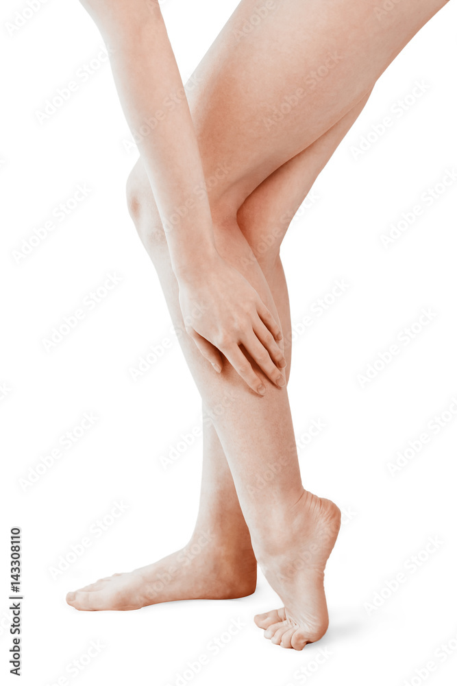 Isolated woman legs being massaged. leg pain concept, young female isolated on white Isolated woman legs being massaged. leg pain concept, young female isolated on white