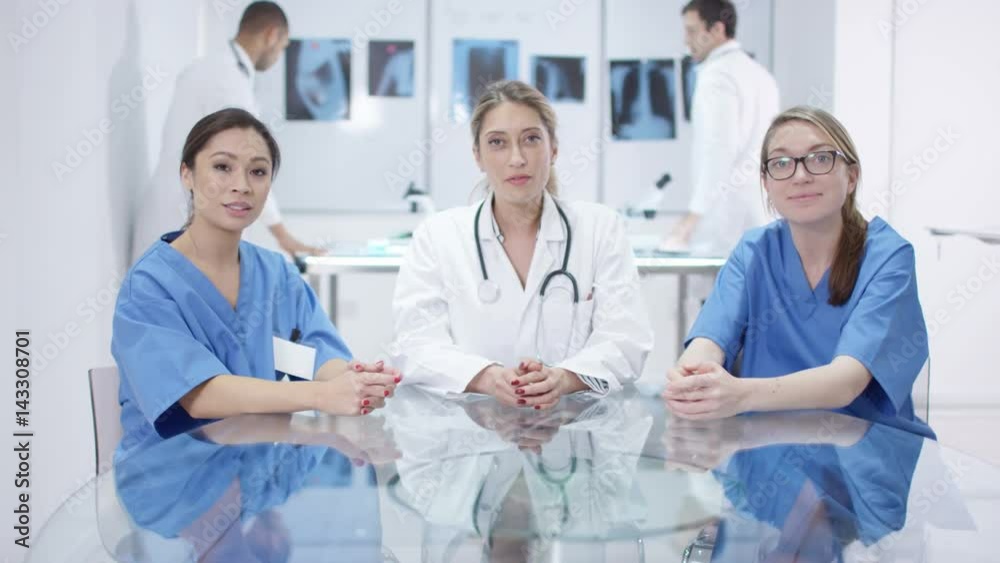 Medical team engaged in video call, seen from computer screen's pov Medical team engaged in video call, seen from computer screen's pov