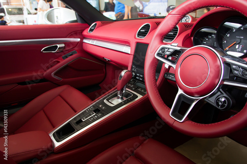 Luxury car Interior - steering wheel, shift lever and dashboard © torsak