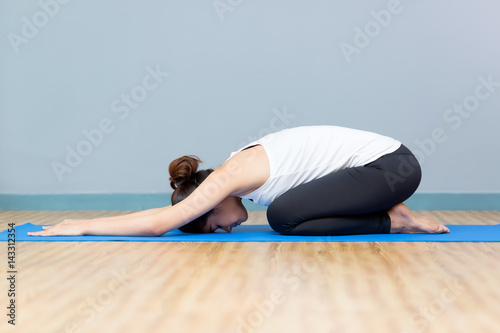 Asian young woman practicing yoga in the room and sport yoga,yoga in the room,sport yoga,yoga practice,yoga relax