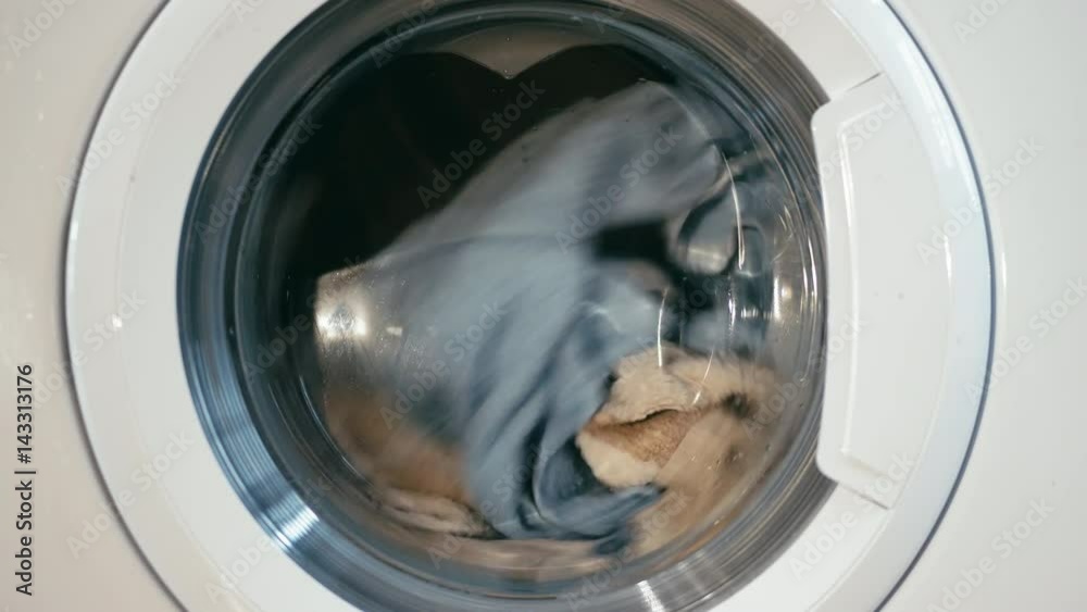 Washing machine turns fast medium shot Washing machine turns fast medium shot