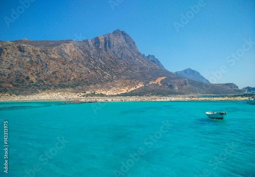 Amazing beach at the scenery Bay of Balos.The confluence of three seas Aegean,Adriatic,Libyan .Beautiful beach with clear water with colorful shades of blue and emerald.Crete island.Greece.Europe.