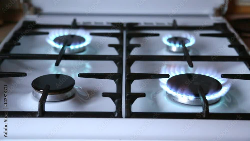 Natural gas inflammation in stove burner. Stove top burners turns one