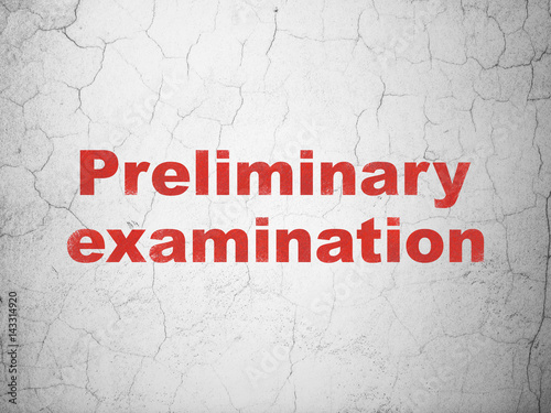 Education concept: Preliminary Examination on wall background