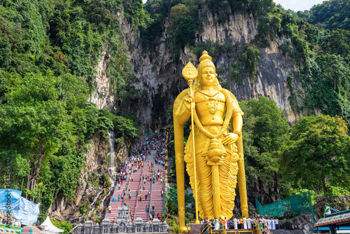 Golden statue of Hindu god Lord Murugan at Batu cave photo