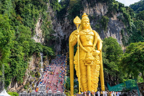 Golden statue of Hindu god Lord Murugan at Batu cave photo