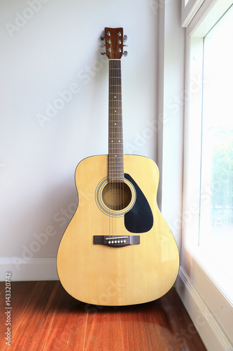 Guitar near the windows, as background.