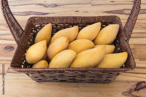 mango in basket on table vintage photo