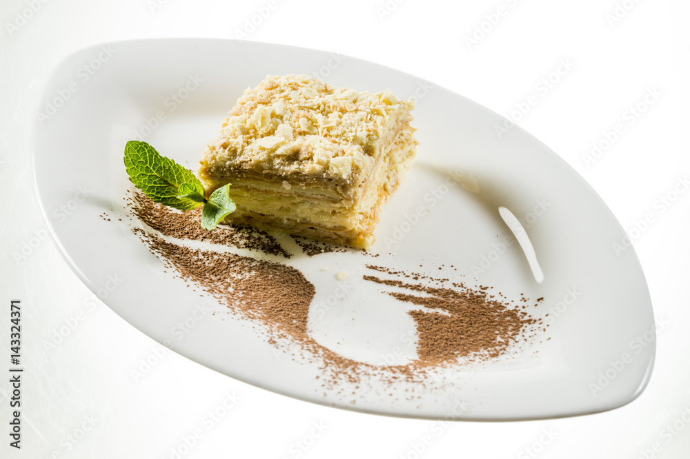 Napoleon cake with mint leaf on a plate