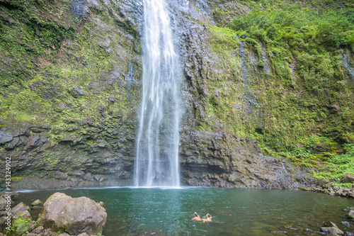 A couple enjoying the amazing Hanakapi ai falls in Kauai island  Hawaii