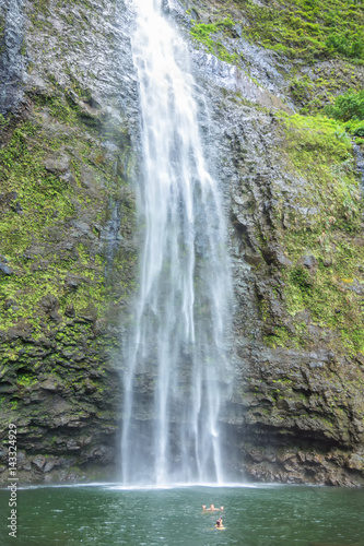 A couple enjoying the amazing Hanakapi ai falls in Kauai island  Hawaii