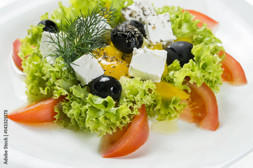 Greek salad on a plate, close-up Greek salad on a plate, close-up