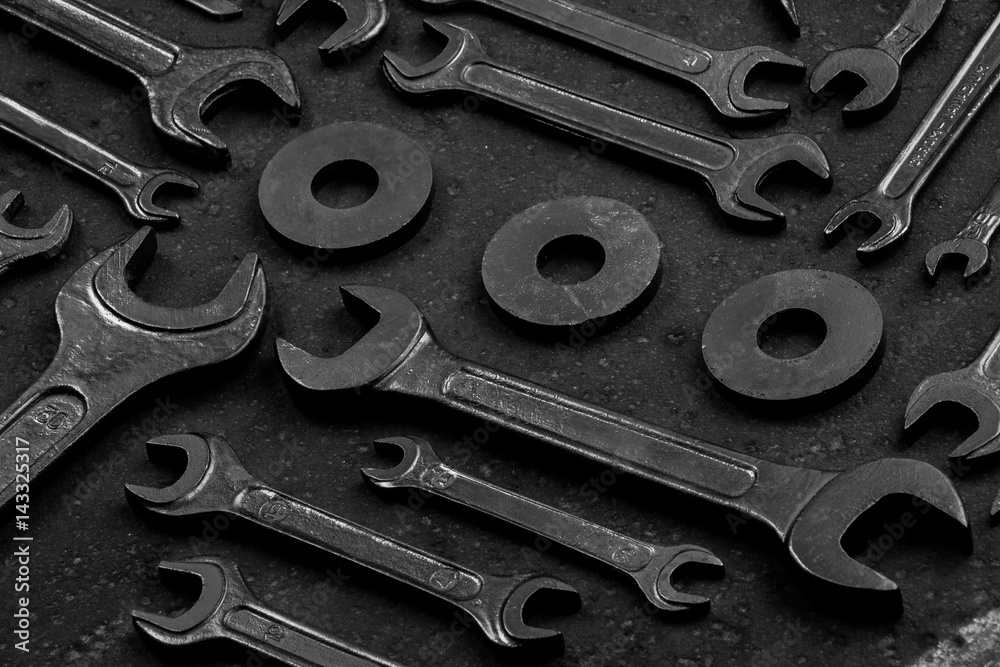 Set of black & white repair tools on black background Set of black & white repair tools on black background