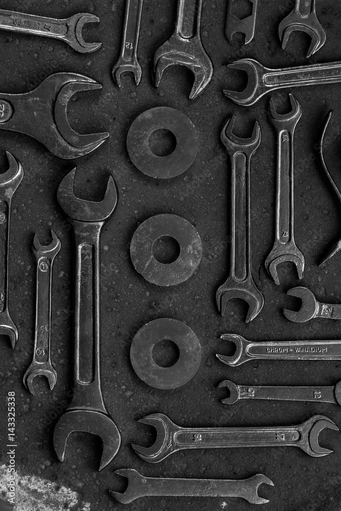 Set of black & white repair tools on black background Set of black & white repair tools on black background