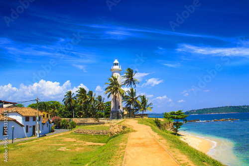 Beautiful view of the famous lighthouse in Fort Galle, Sri Lanka, on a sunny day photo