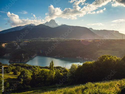 Fototapeta Naklejka Na Ścianę i Meble -  Mountains above the lake with sunset, French Alps