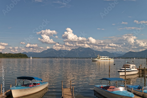 Bavaria, Chiemsee - Lake tour with silhouette of the Alps in the background.