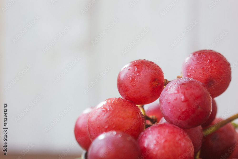 Close view of grapes over the white background.