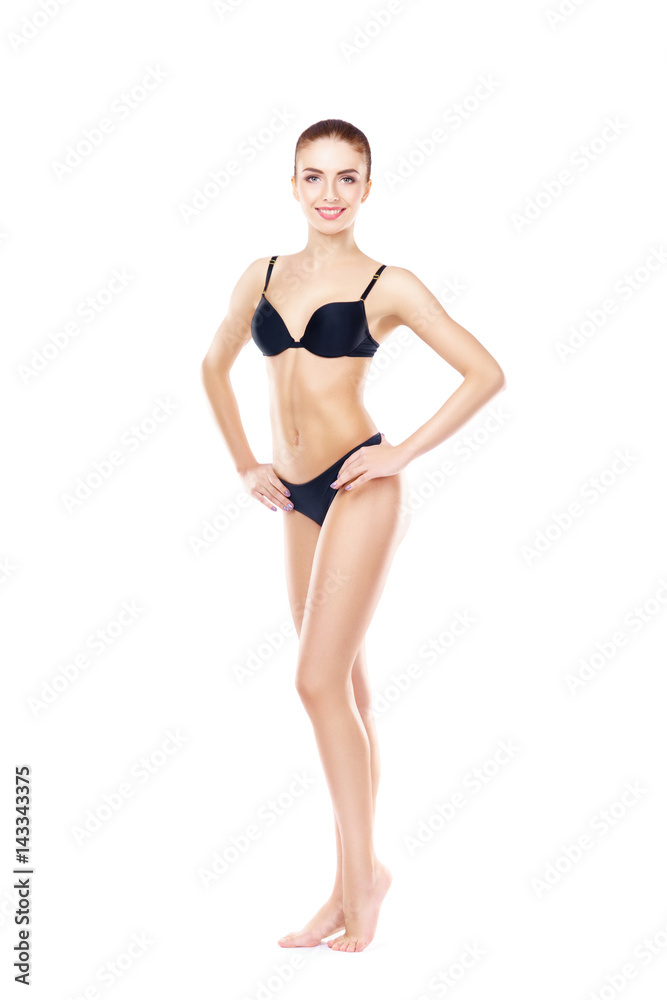 Fototapeta premium Fit, healthy and sporty woman in black underwear isolated on white. Sport, fitness, diet, weight loss and healthcare concept.