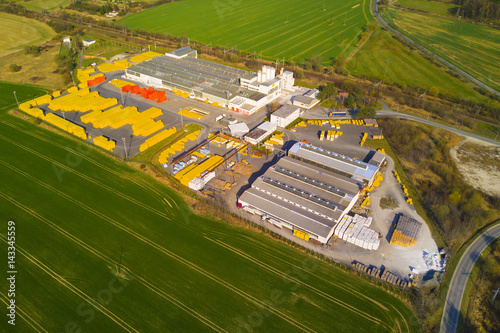 Aerial view of factory plant producing autoclaved aerated concrete. Top view of industrial area.